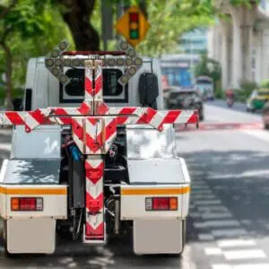 Rear view of a tow truck on street.