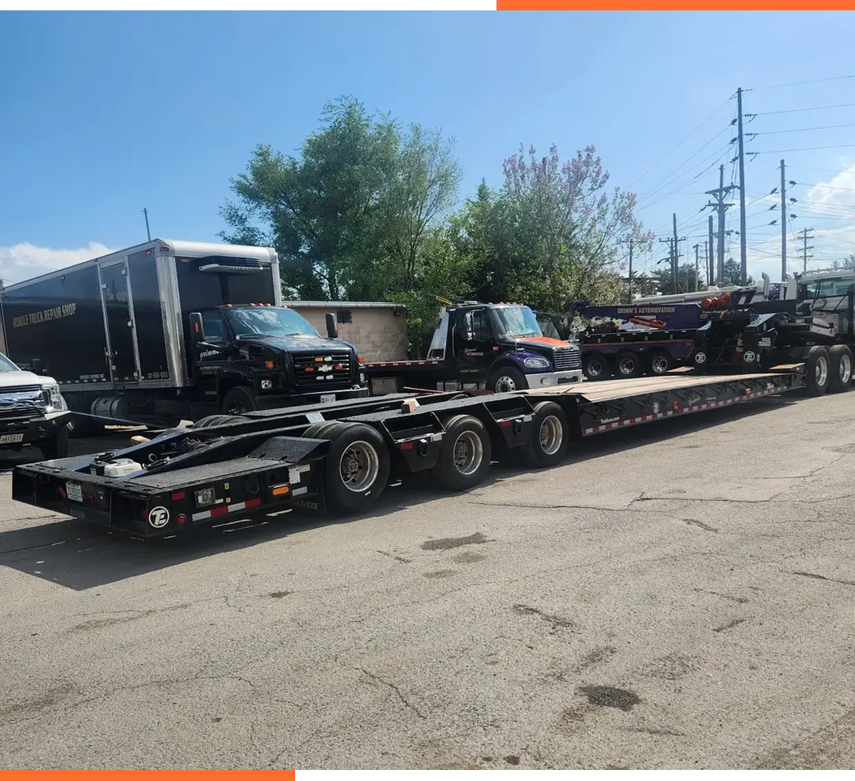 A truck is parked on the side of the road.